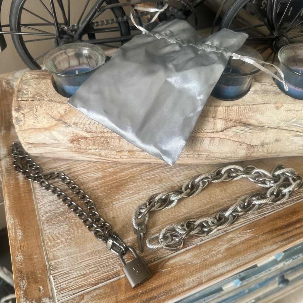 Louis Vuitton lock with the key + chains.